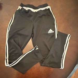 Adidas Pants in black with white side stripes.  Size small.